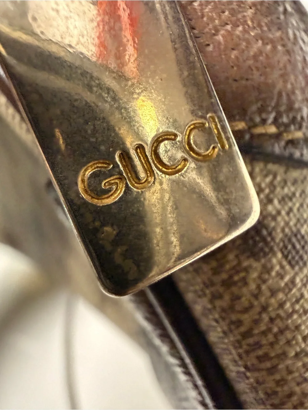 Gucci Gold-Tone Logo Plate on Dark Brown Leather